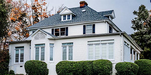 White Roanoke, VA home with black roof installed by Commonwealth Roofing Specialists White Roanoke, VA home with black roof installed by Commonwealth Roofing Specialists